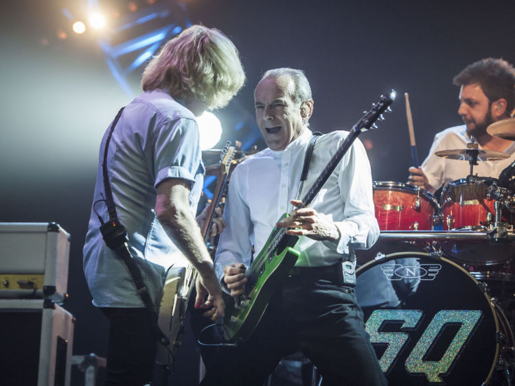 Rick Parfitt (left) and Francis Rossi (centre) of Status Quo on stage at the Isle of Wight Festival, in Seaclose Park, Newport, Isle of Wight.
